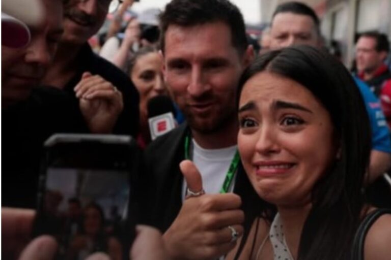 Maia Reficco posa sonriente junto a Lionel Messi en el paddock del Gran Premio de Miami