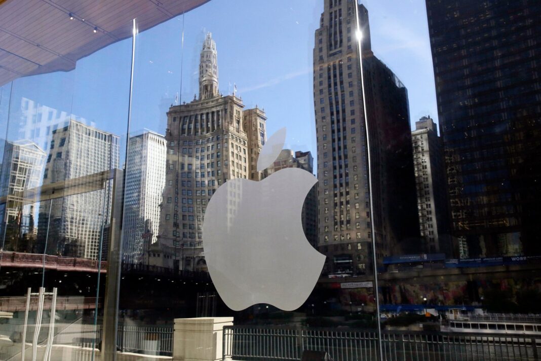 Logotipos de Apple y Broadcom sobre un fondo de circuitos electrónicos