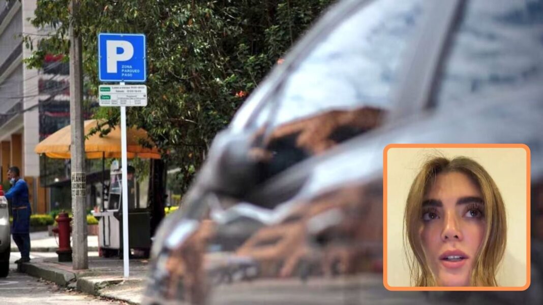 Ventana trasera rota de un automóvil estacionado en zona de parqueo pago en Bogotá